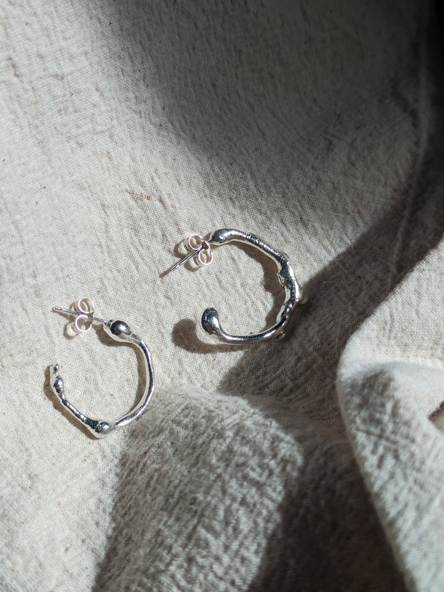 Molten sterling silver hoops - Hiraeth Hoops
