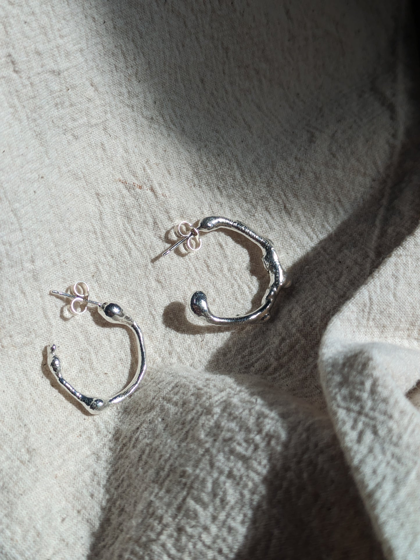 Molten sterling silver hoops