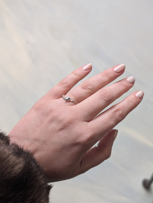 Molten silver band with sapphire