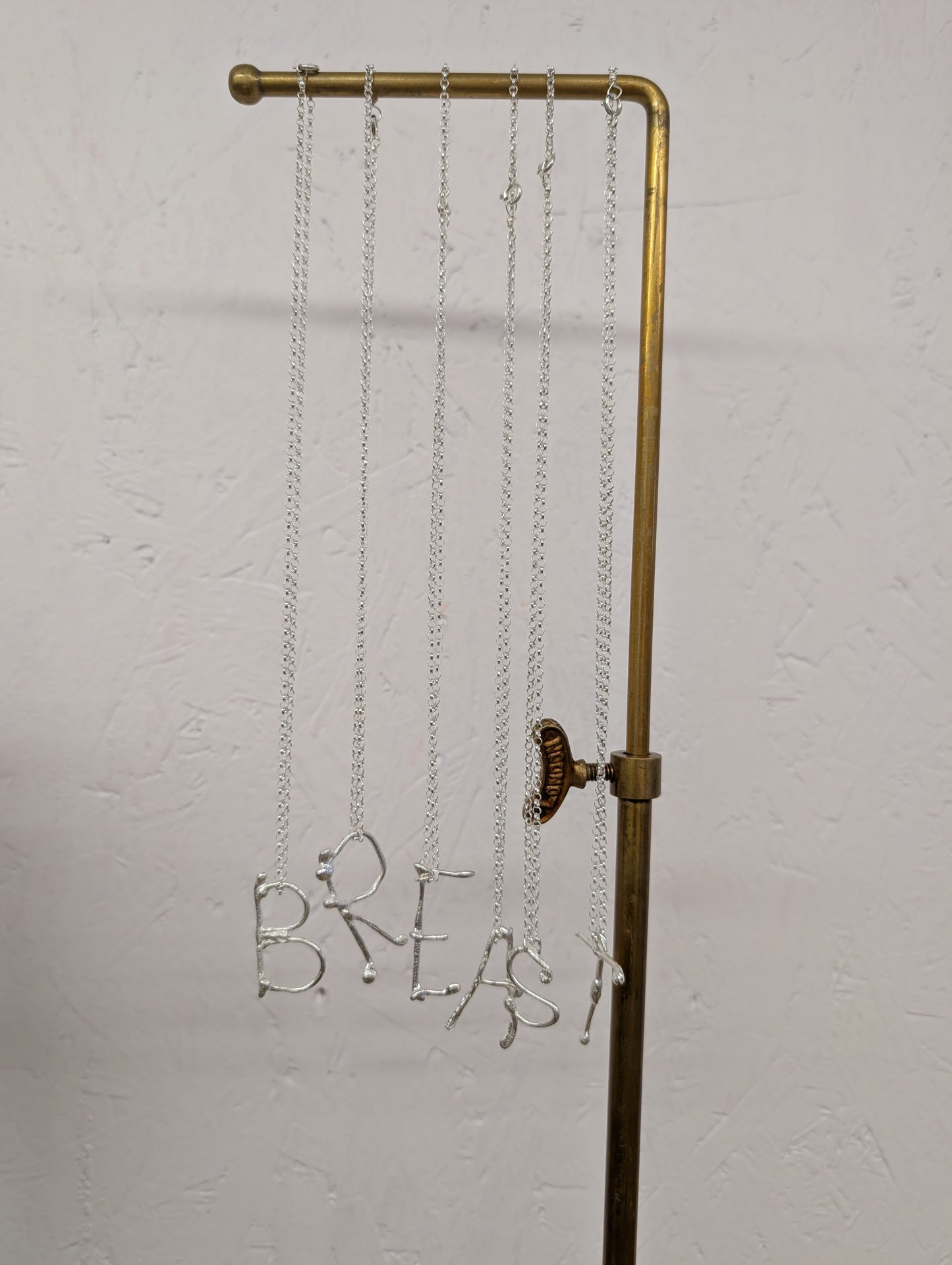 Molten initial necklace
