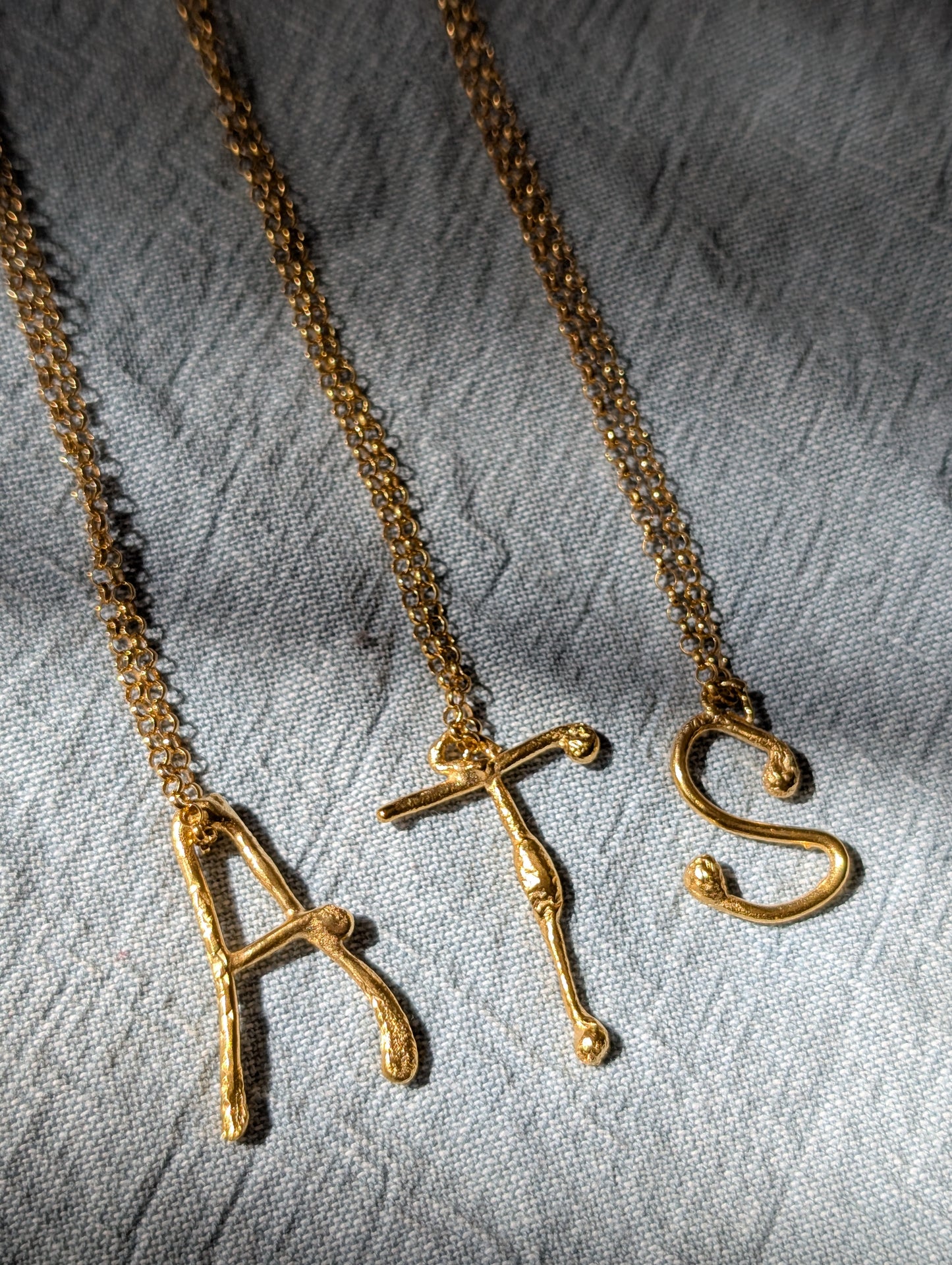 Molten initial necklace