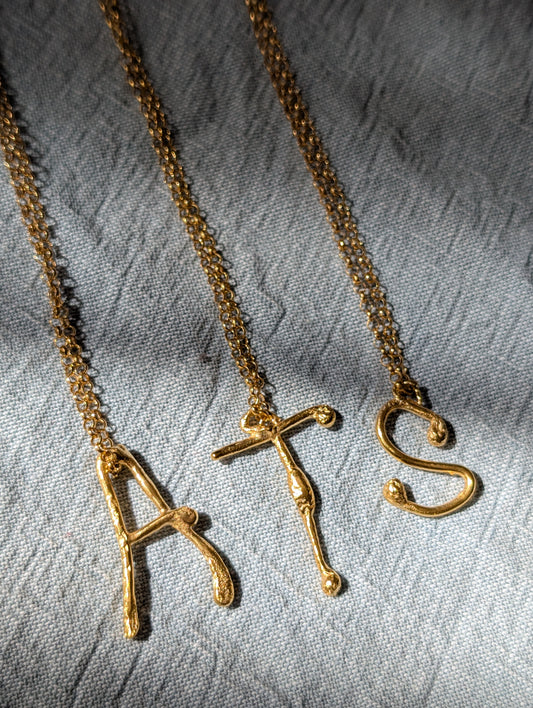 Molten initial necklace