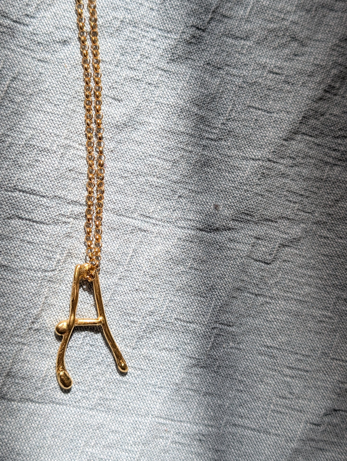 Molten initial necklace